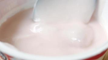 Close up of spoon in yogurt video