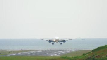 Widebody airplane approaching and landing at Phuket International airport. video