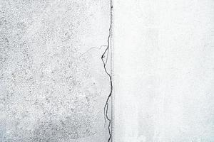 Crack cemant concrete wall, broken building surface texture background. photo