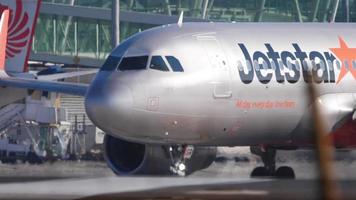 PHUKET, THAILAND DECEMBER 3, 2016 - Jetstar Airbus 320 9V JSP turning to runway before departure at Phuket airport. Rainy weather video