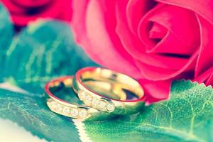 Close up Gold ring and Red roses photo