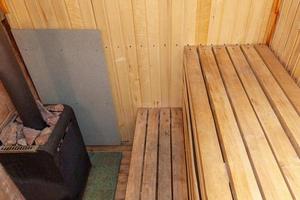 Interior details of traditional Finnish sauna steam room. Traditional old Russian bathhouse SPA Concept. Relax country village bath concept. photo