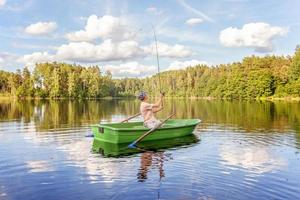 Fisherman in a boat photo