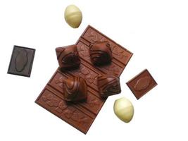 Black and milk chocolate with almonds on a white background photo
