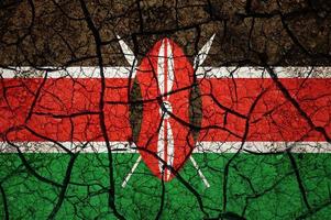 Dry soil pattern on the flag of Kenya. Country with drought concept. Water problem. Dry cracked earth country. photo