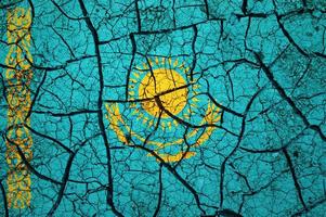 Dry soil pattern on the flag of Kazakhstan. Country with drought concept. Water problem. Dry cracked earth country. photo