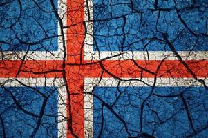 Dry soil pattern on the flag of Iceland. Country with drought concept. Water problem. Dry cracked earth country. photo