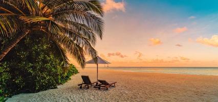 Amazing beach. Chairs on the sandy beach sea. Luxury summer holiday and vacation resort hotel for tourism. Inspirational tropical landscape. Tranquil scenery, relax beach, beautiful landscape design photo