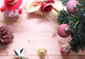 Christmas tree background with decorations on wooden board.selective focus at ball photo
