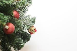 christmas tree with decorations ball and box gift on white background.selective focus at box photo