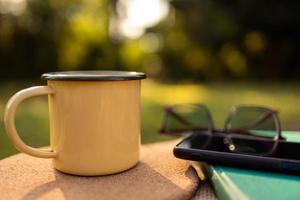 Coffee mugs in the backyard and morning sunshine. photo