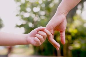 Children's hands with care, concern, warmth of mothers. photo