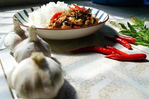 Stir-fried basil with minced pork is a popular dish because it's quick and easy to make.  spicy taste photo