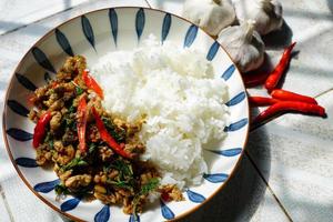 Stir-fried basil with minced pork is a popular dish because it's quick and easy to make.  spicy taste photo