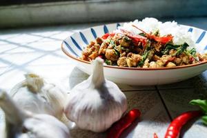 Stir-fried basil with minced pork is a popular dish because it's quick and easy to make.  spicy taste photo