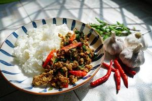 Stir-fried basil with minced pork is a popular dish because it's quick and easy to make.  spicy taste photo