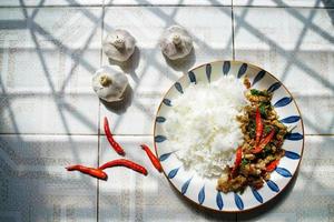 Stir-fried basil with minced pork is a popular dish because it's quick and easy to make.  spicy taste photo