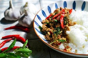 Stir-fried basil with minced pork is a popular dish because it's quick and easy to make.  spicy taste photo