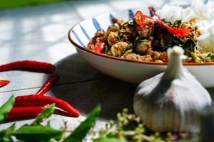 Stir-fried basil with minced pork is a popular dish because it's quick and easy to make.  spicy taste photo
