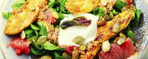 Salad with chicken, lettuce and grapefruit photo