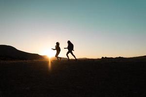 Running people over rough terrain. photo