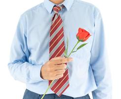 Man holding with red rose on white background photo