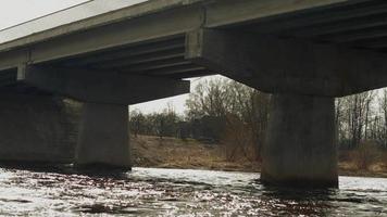 Bridge over river in a cloudy day video