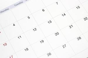 fechas en el fondo de la página del calendario, primer plano de los números en la página del calendario foto