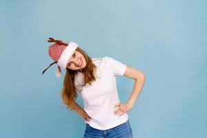 Portrait of an excited smiling caucasian girl dressed as christmas deer photo