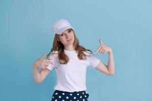 Young caucasian girl in delivery uniform and white cap looks confident photo