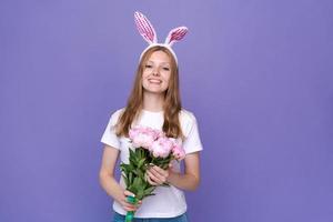 Easter holidays, spring concept - happy funny, crazy young girl in headband photo