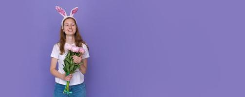 Easter holidays, spring concept - happy funny, crazy young girl in headband photo