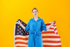 Celebration Independence Day. Stars and stripes. Young woman holding United photo