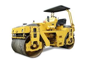 Solo, Central Java, Indonesia, 2022 - road  roller, a yellow asphalt road smoothing machine on a small village photo