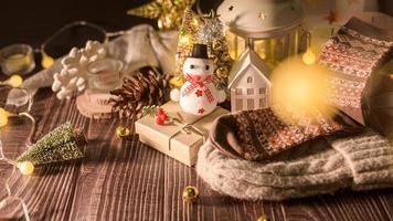 Christmas and Winter decorations on wooden table with decorative lights , Christmas background photo