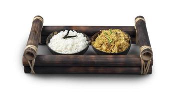 Traditional Indian veg and rice served in a bamboo frame photo