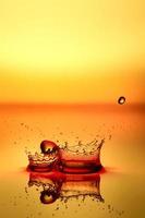 splash of water on a yellow background photo