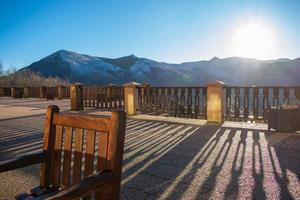 sunset from wooden terrace in the mountains photo