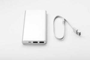 Power bank for charging mobile devices and gadgets on a white background photo