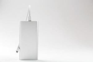 Power bank for charging mobile devices and gadgets on a white background photo