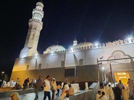 Medina, Saudi Arabia, Oct 2022 - A beautiful view of the minarets and dome of the Quba Mosque in Medina, Saudi Arabia at night. photo