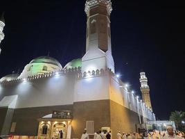 Medina, Saudi Arabia, Oct 2022 - A beautiful view of the minarets and dome of the Quba Mosque in Medina, Saudi Arabia at night. photo