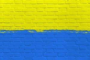 Yellow and Blue Flag of Ukraine on Clean Wall, Industrial Graphic, Symbol of Freedom, Grunge Style Picture, Fight in War with Russia, Symbolic Image, Texture on urban surface, Patriotic background photo
