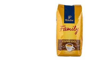 Warsaw, Poland - October 18, 2022- One kilogram bag of Tchibo Family Espresso coffee beans. White isolated background photo