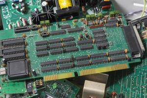 selective focus of Electronic waste of PCB circuit board. Recycling of electronic waste. photo