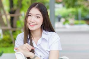 Portrait of an adult Thai student in university student uniform photo