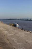 A transport port on the Mekong River in Nakhon Phanom province where people are exercising. photo