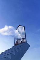 The stairs lead towards the sky with a dimensional portal inside of which there is a factory where smoke emanates from the door into clouds. photo