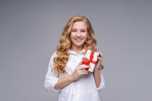 Presented delivery, holidays holiday concept. Excited caucasian teen girl photo