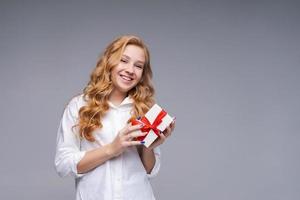 Presented delivery, holidays holiday concept. Excited caucasian teen girl photo